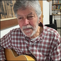 Jonathan Ochshorn playing guitar